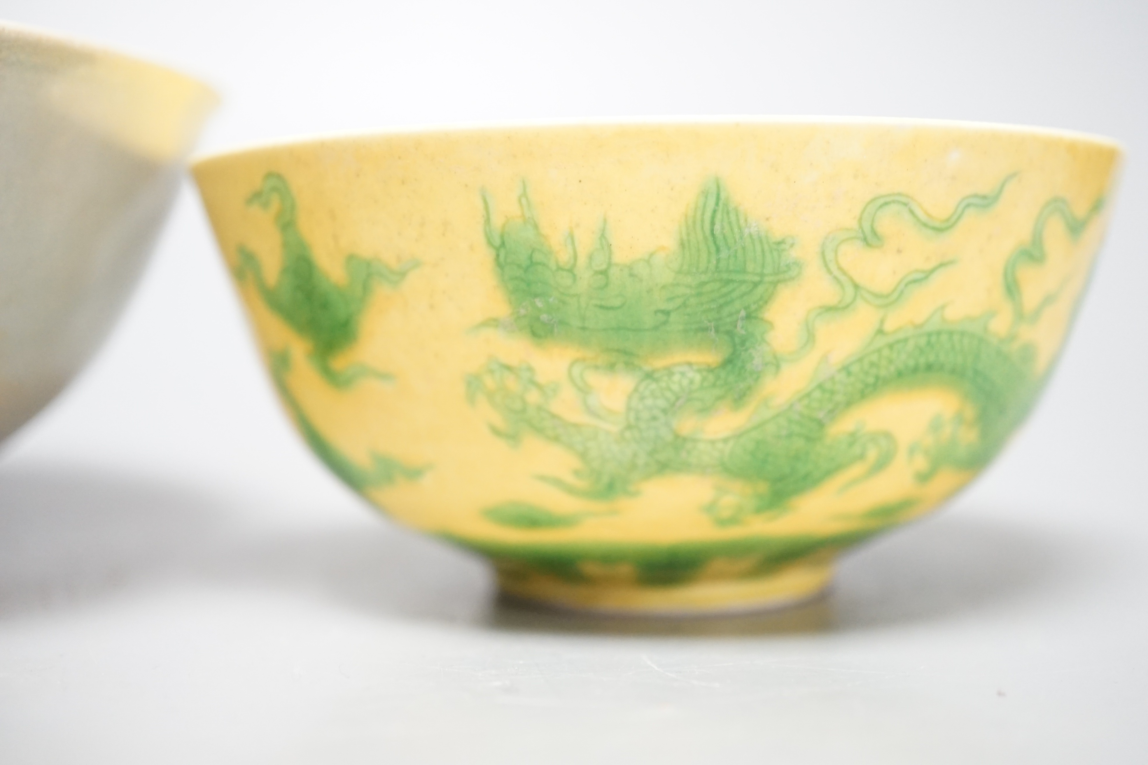A Chinese Teksing cargo bowl c1820 and a yellow ground 'dragon' bowl. Largest 16cm diameter.